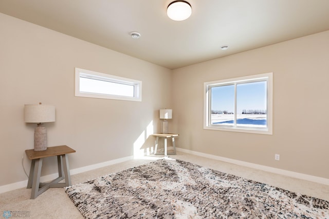 1600 5th Ave NE, Dilworth, MN 56529 - carpeted spare room featuring baseboards and a smoke detector