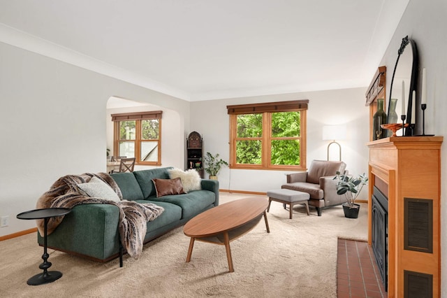 4313 Arthur St NE, Columbia Heights, MN 55421 - living room with carpet, arched walkways, a fireplace with flush hearth, and plenty of natural light