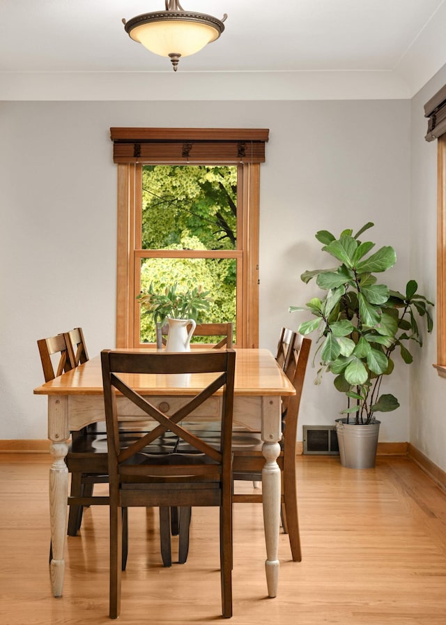 4313 Arthur St NE, Columbia Heights, MN 55421 - dining area featuring light wood-style flooring and baseboards