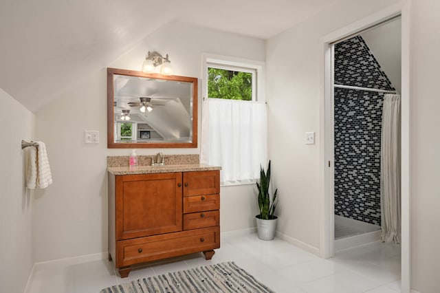 4313 Arthur St NE, Columbia Heights, MN 55421 - bathroom with a shower stall, vanity, lofted ceiling, tile patterned flooring, and baseboards