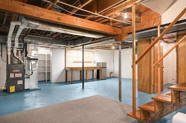 4313 Arthur St NE, Columbia Heights, MN 55421 - unfinished basement with freestanding refrigerator, stairs, and heating unit