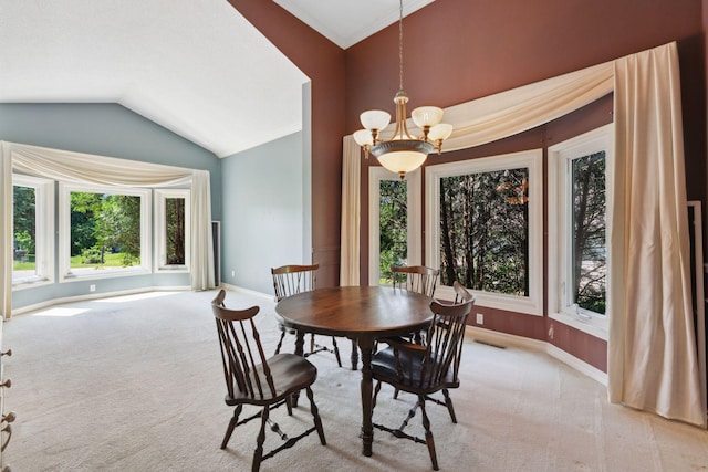 13914 Duluth Dr, Apple Valley, MN 55124 - dining space with healthy amount of natural light, a chandelier, light carpet, vaulted ceiling, and ornamental molding