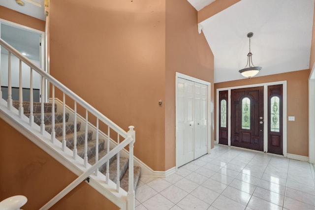 13914 Duluth Dr, Apple Valley, MN 55124 - foyer with baseboards, high vaulted ceiling, and stairs