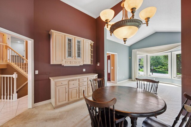 13914 Duluth Dr, Apple Valley, MN 55124 - dining room featuring light carpet, crown molding, vaulted ceiling, and stairway