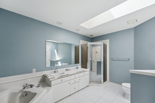 13914 Duluth Dr, Apple Valley, MN 55124 - bathroom with a skylight, a garden tub, tile patterned flooring, and double vanity