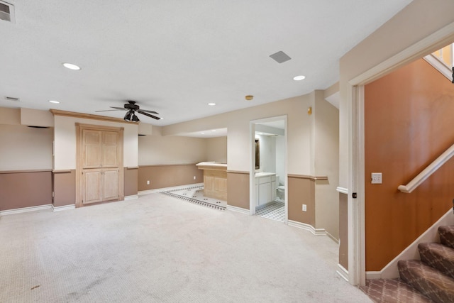 13914 Duluth Dr, Apple Valley, MN 55124 - unfurnished living room featuring light carpet, ceiling fan, recessed lighting, stairway, and baseboards