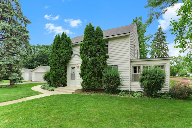 1206 2nd St W, Hastings, MN 55033 - view of front of home with a garage, a front yard, and an outdoor structure