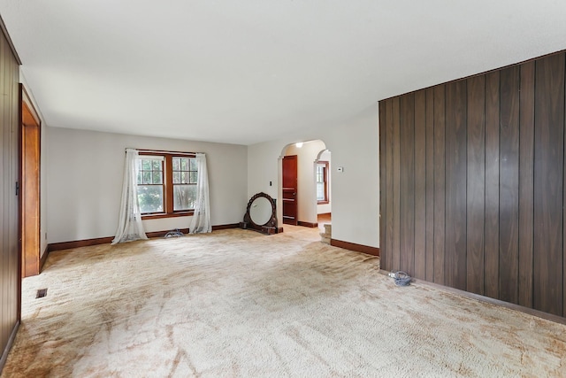 1206 2nd St W, Hastings, MN 55033 - carpeted empty room with arched walkways and baseboards