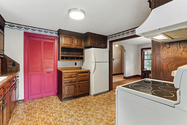 1206 2nd St W, Hastings, MN 55033 - kitchen featuring white appliances, custom range hood, arched walkways, light flooring, and open shelves