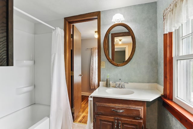 1206 2nd St W, Hastings, MN 55033 - full bathroom with vanity, shower / bath combination with curtain, and wood finished floors