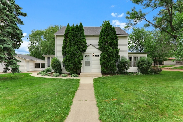 1206 2nd St W, Hastings, MN 55033 - view of front facade featuring a front yard and a shingled roof