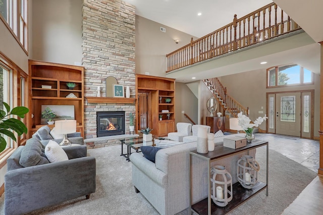904 Ridgecrest Dr, Carver, MN 55315 - living room with a high ceiling, plenty of natural light, stairway, a stone fireplace, and recessed lighting