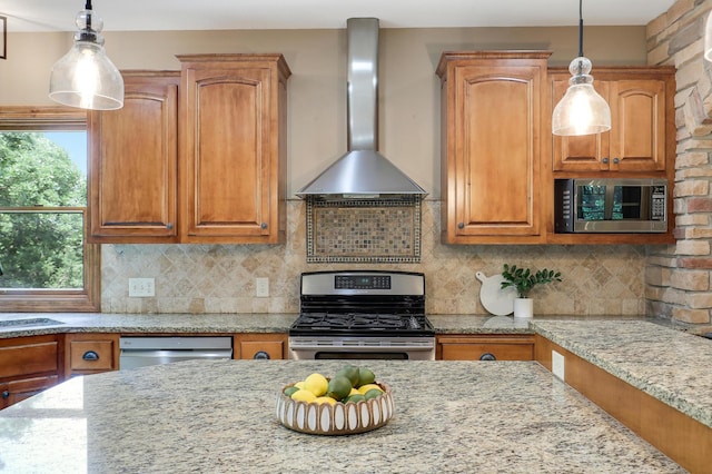 904 Ridgecrest Dr, Carver, MN 55315 - kitchen featuring stainless steel appliances, wall chimney range hood, light stone countertops, brown cabinetry, and hanging light fixtures