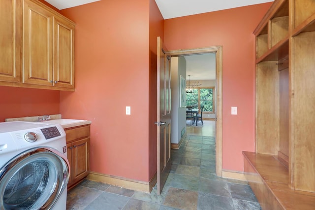 904 Ridgecrest Dr, Carver, MN 55315 - washroom featuring washer / dryer, cabinet space, stone finish flooring, and a chandelier
