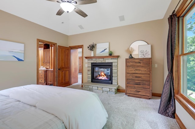 904 Ridgecrest Dr, Carver, MN 55315 - carpeted bedroom featuring multiple windows, a fireplace, and ceiling fan