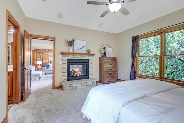 904 Ridgecrest Dr, Carver, MN 55315 - bedroom with carpet floors, a fireplace, and a ceiling fan