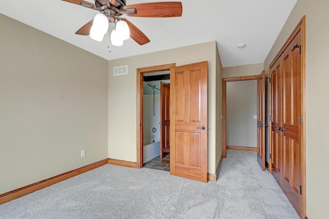 904 Ridgecrest Dr, Carver, MN 55315 - unfurnished bedroom with carpet, connected bathroom, and ceiling fan