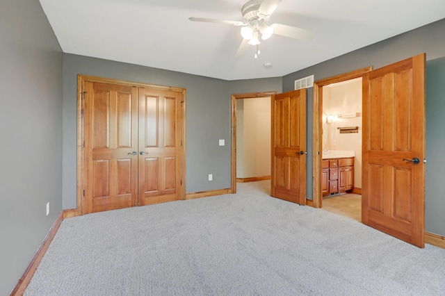 904 Ridgecrest Dr, Carver, MN 55315 - unfurnished bedroom with light carpet, a closet, ensuite bathroom, and ceiling fan