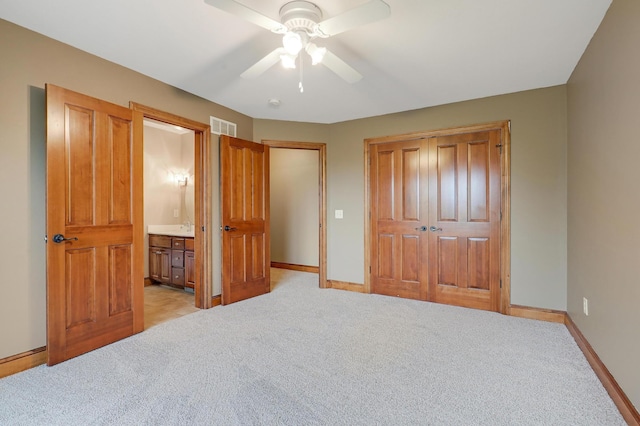 904 Ridgecrest Dr, Carver, MN 55315 - bedroom featuring a closet, light colored carpet, ensuite bathroom, and ceiling fan
