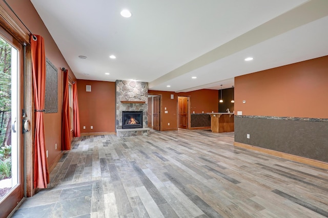 904 Ridgecrest Dr, Carver, MN 55315 - unfurnished living room featuring wood finished floors, a fireplace, and recessed lighting