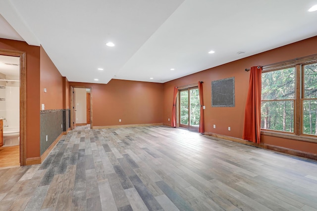 904 Ridgecrest Dr, Carver, MN 55315 - unfurnished living room with light wood-style flooring and recessed lighting