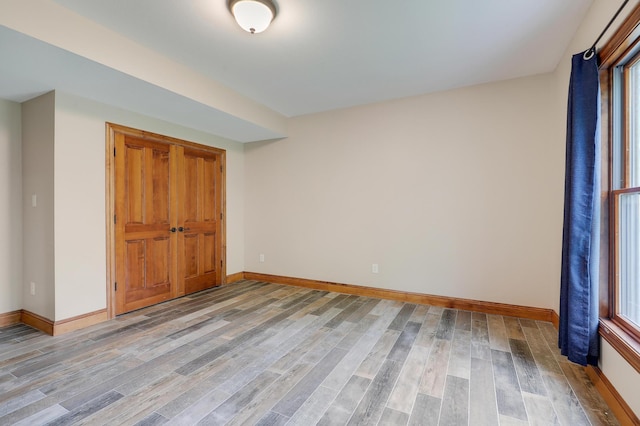 904 Ridgecrest Dr, Carver, MN 55315 - unfurnished bedroom with light wood-style floors and baseboards