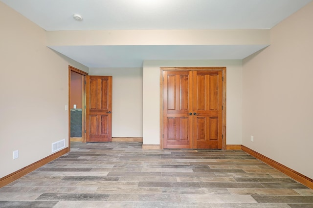 904 Ridgecrest Dr, Carver, MN 55315 - unfurnished bedroom with baseboards and wood finished floors