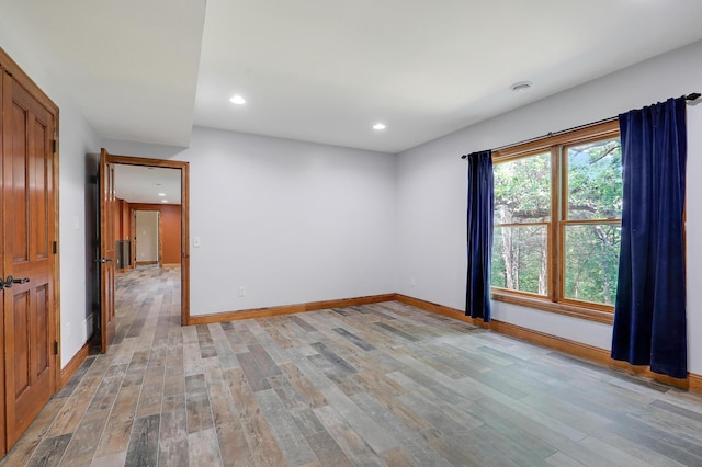 904 Ridgecrest Dr, Carver, MN 55315 - empty room with light wood-style flooring and recessed lighting