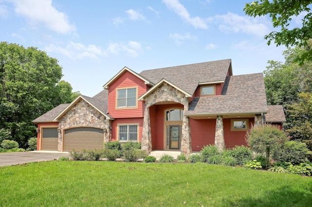 904 Ridgecrest Dr, Carver, MN 55315 - craftsman-style home with stone siding, driveway, a garage, a front yard, and a shingled roof