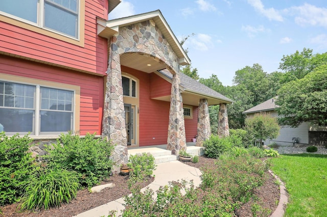 904 Ridgecrest Dr, Carver, MN 55315 - property entrance featuring stone siding and a porch
