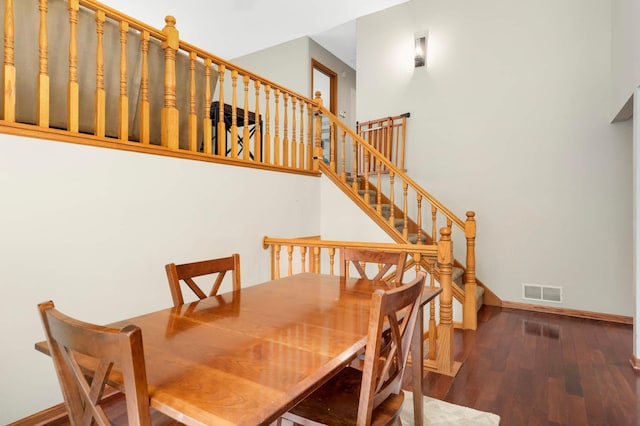2745 Maplewood Cir, Monticello, MN 55362 - dining room with baseboards, wood finished floors, and stairway