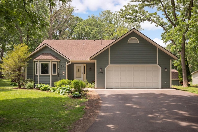 2745 Maplewood Cir, Monticello, MN 55362 - single story home featuring asphalt driveway, a front yard, roof with shingles, and an attached garage