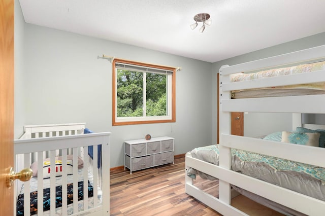 2745 Maplewood Cir, Monticello, MN 55362 - bedroom featuring wood finished floors and baseboards