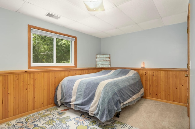 2745 Maplewood Cir, Monticello, MN 55362 - bedroom featuring a drop ceiling, wood walls, and wainscoting