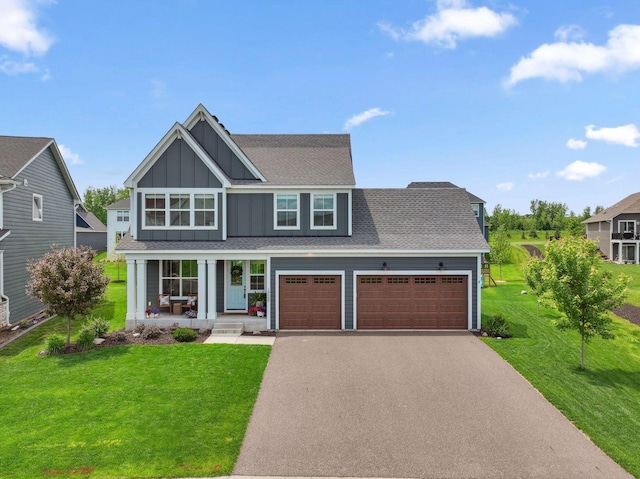 10680 38th Trl N, Lake Elmo, MN 55042 - view of front of property featuring board and batten siding, driveway, a porch, and a front yard