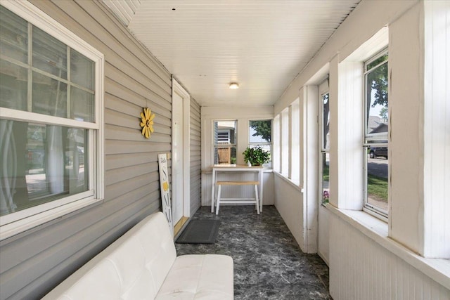 311 Franklin St, Lake City, MN 55041 - sunroom with healthy amount of natural light and wood walls