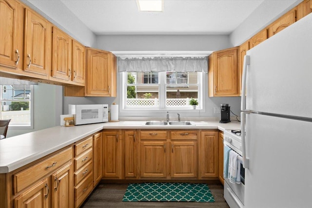 311 Franklin St, Lake City, MN 55041 - kitchen with white appliances, a sink, healthy amount of natural light, and light countertops
