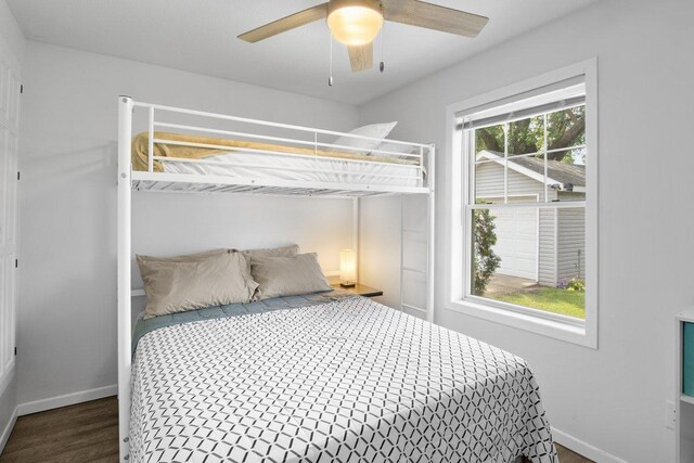 311 Franklin St, Lake City, MN 55041 - bedroom featuring baseboards, wood finished floors, and ceiling fan