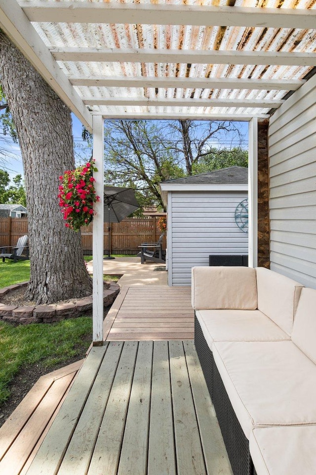 311 Franklin St, Lake City, MN 55041 - wooden deck featuring a fenced backyard, outdoor lounge area, and a pergola