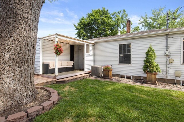 311 Franklin St, Lake City, MN 55041 - back of house with a wooden deck, a chimney, a yard, an outdoor living space, and cooling unit