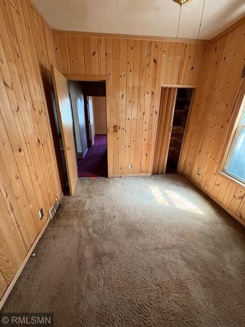 1539 Iglehart Ave, Saint Paul, MN 55104 - spare room featuring wood walls and carpet floors
