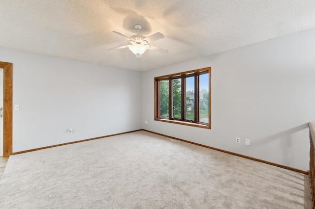 14737 Endicott Way, Apple Valley, MN 55124 - empty room with a ceiling fan, light colored carpet, a textured ceiling, and baseboards