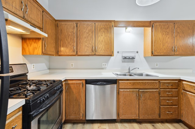 14737 Endicott Way, Apple Valley, MN 55124 - kitchen featuring appliances with stainless steel finishes, a sink, under cabinet range hood, and light countertops