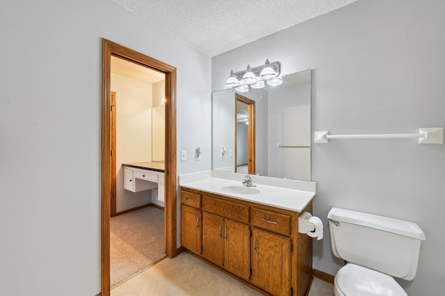 14737 Endicott Way, Apple Valley, MN 55124 - bathroom featuring vanity, toilet, a textured ceiling, baseboards, and tile patterned flooring