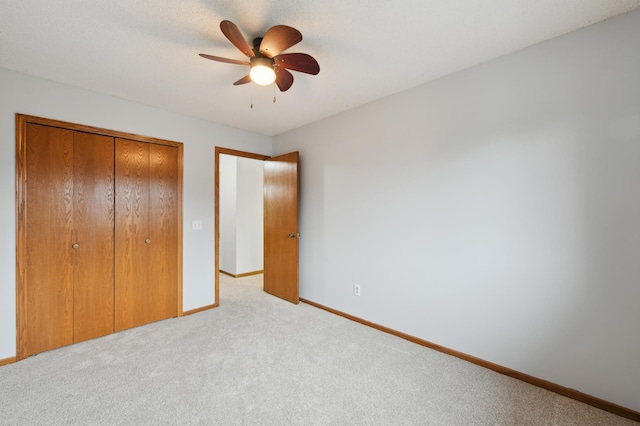 14737 Endicott Way, Apple Valley, MN 55124 - unfurnished bedroom with carpet flooring, a closet, baseboards, and a ceiling fan