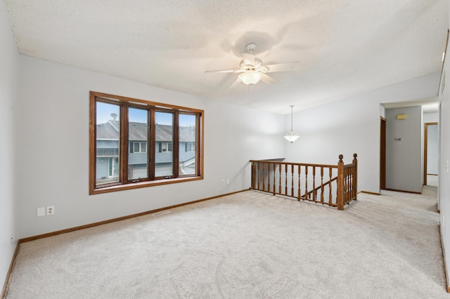 14737 Endicott Way, Apple Valley, MN 55124 - carpeted spare room with a ceiling fan, baseboards, and a textured ceiling