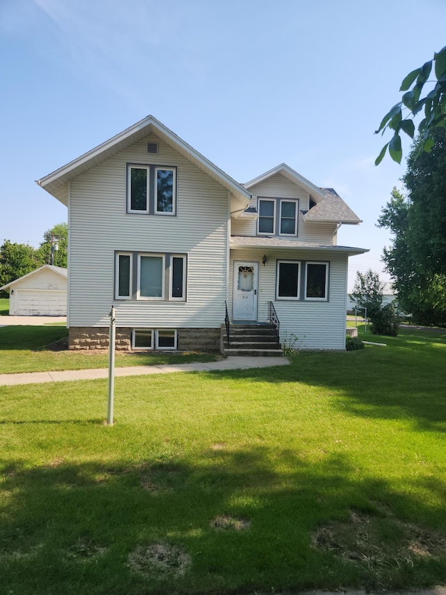 313 2nd St, Hills, MN 56138 - view of front of property featuring a front yard
