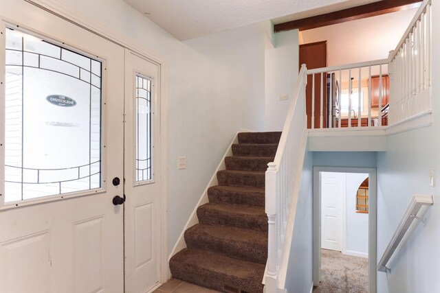 8317 Penn Ave N, Brooklyn Park, MN 55444 - foyer with stairs and baseboards