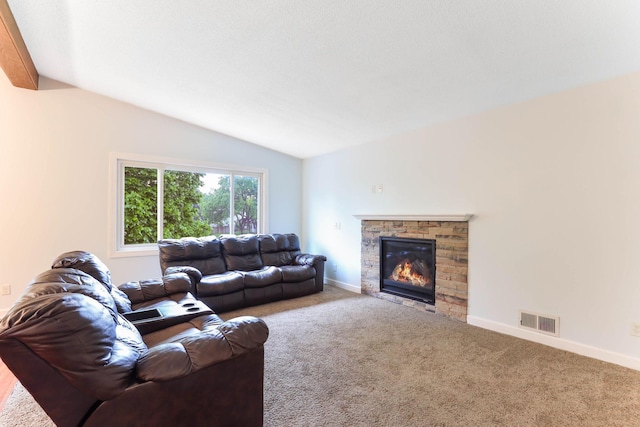 8317 Penn Ave N, Brooklyn Park, MN 55444 - living room with lofted ceiling, carpet flooring, a stone fireplace, and baseboards