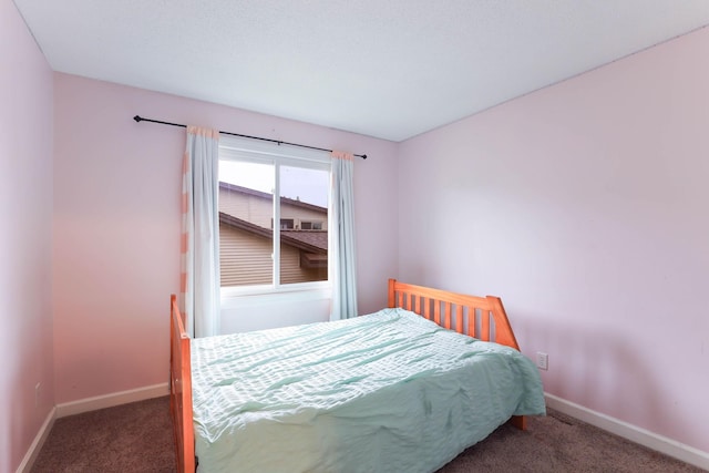 8317 Penn Ave N, Brooklyn Park, MN 55444 - carpeted bedroom with baseboards